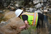 Jason Sanchez panning for gold at Box Creek Mine