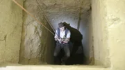 Josh Gates plummets into the darkness of an ancient Egyptian tomb.