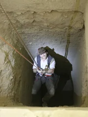 Josh Gates plummets into the darkness of an ancient Egyptian tomb.