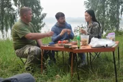 GEOFFREY, VARYA, and IGOR camping.