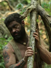 Bulent carrying a log.