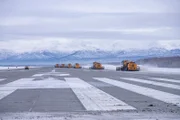 SNOW CLEANING MACHINES OUT ON RUNWAY