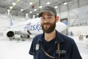 TOM COOK, TECHNICIAN, IN ALASKA AIRLINES HANGAR