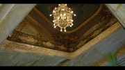 Luxurious marble foyer with chandelier.