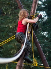 Bear Brown climbs piling.