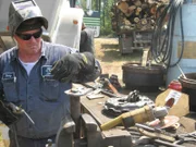 Bobby repairing a piece of equipment by sautering it.