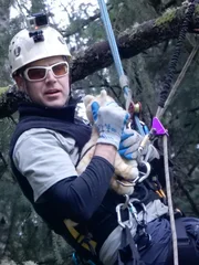 Using a stuffed cat, Shaun Sears demonstrates the proper way to hold a cat during a rescue.