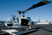 El Paso, TX: Agents fixing and checking their helicopter.