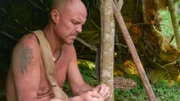 Wes peeling fruit in shelter