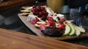 A fruit and cheese plate is a specialty at Indulge Bistrow and Wine Bar in Highlands Ranch, Colorado, as seen on Food Network's Mystery Diners, Season 7.