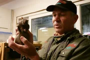 Michael Beran holding a rat at Wildlife Comman Center.
