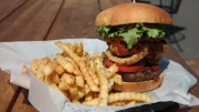 Burger and fries dish from A la Carts Food Pavilion, as seen on Food Network's Mystery Diners, Season 8.