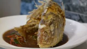 A fried fish in its entirety from Chef Chai in Honolulu, as seen on Food Network's Mystery Diners, Season 8.