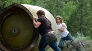 Gabe and Bear place water tank.