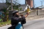 Antoine Batiste (Wendell Pierce) has just haggled with the cabbie and is crossing the street to catch up with the band and Second Line parade in Scene 4 of the pilot episode of TREME: "Do You Know What It Means" in New Orleans, Louisiana. In this scene, Antoine Batiste (Wendell Pierce) haggles with the cabbie as the Second Line parade rolls on outside the Social Aid & Pleasure Club. *** Local Caption *** Antoine Batiste (Wendell Pierce). Day 8 of 17