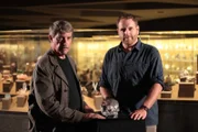 Josh Gates and Bill Homann with the crystal skull.