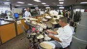Playing drums.
