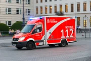 Mercedes-Benz Sprinter firetruck speeding to an emergency in the city street