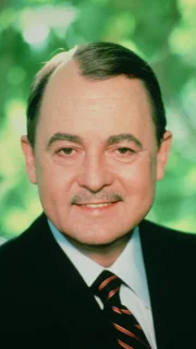 Higgins (John Hillerman)