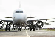 Close up of Plane landing on runway at eCube Solutions