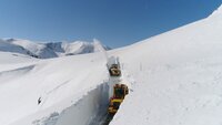 Snow plowing machines clearing the road. (National Geographic)