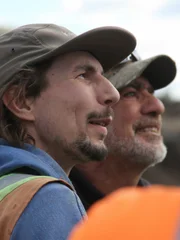 Side profile of Parker and Doumitt smiling.