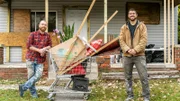 Keith Bynum (L) and Evan Thomas (R) standing outside of Cherrylawn home with their shopping cart