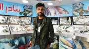 Yazan at work in the fish store