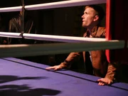 Chris looks up into the boxing ring.
