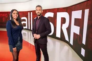 L-R: Tama Vakeesan und Mario Grossniklaus moderieren die TV-Sendung am 12. Januar 2022