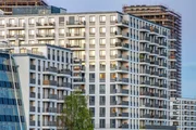 Big modern apartment building and the construction of another one seen in Berlin, Germany