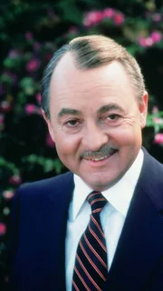 Higgins (John Hillerman)