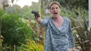 Vennie points the gun.