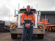 Tez standing in front of his truck in Crouch depot