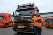 Buzz standing in front of Crouch truck