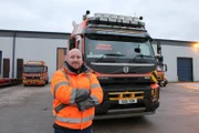 Buzz standing in front of Crouch truck