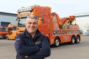 Steve Kelly standing in front of truck