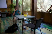 Brey talking on the phone with his prison match