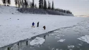 Jody Potts-Joseph, Jamey Joseph, and Denali Black gather water from the river for their camp. (National Geographic)