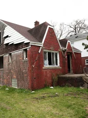 An outside photo of the exterior of the goth house pre-renovation, as seen on Bargain Block, Season 2.