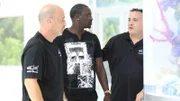 Wayde explains the technical specs of the tank to Akon.
