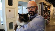 Jackson holding a cat.