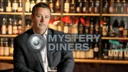 Host Charles Stiles at the bar, as seen on Food Network's Mystery Diners (500 and 600 series).