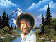 Bob Ross vor einem seiner Landschaftsbilder.