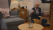 Jackson playing with cat.