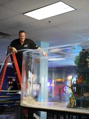 Wayde fills the tank with water.