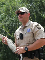 Dustin Dockery holding an alligator.