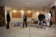 Wayde and Brett consult with Debbie and Steve.