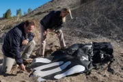 Ayr, ON - REENACTMENT - An NTSB crash investigator played by Dimitri Vantis surveys the debris from the Virgin Galactic SS2 crash as Lorenda Ward played by Marnie Robinson arrives on the scene to examie the casing. (Cineflix 2017/Darren Goldstein)