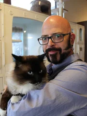 Jackson holding a cat.